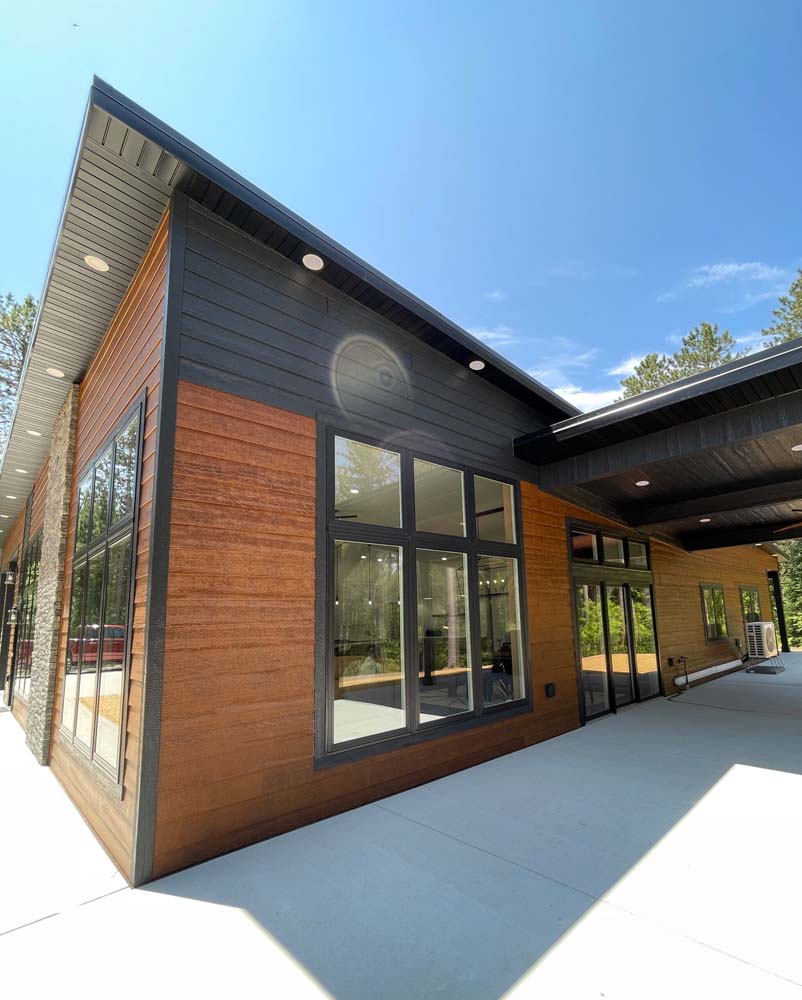 A breathtaking post modern home outfitted wit the latest Diamond Kote Siding.